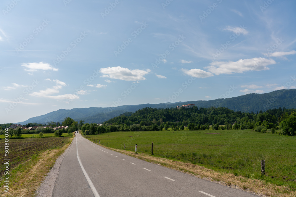 Rural landscape showing the road in the direction of Bled, a Slovenian town famous for its lake and castle