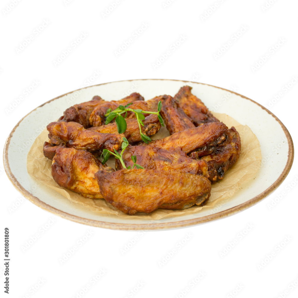 chicken wings in honey in a plate with no background chicken wings in honey in a plate with no background