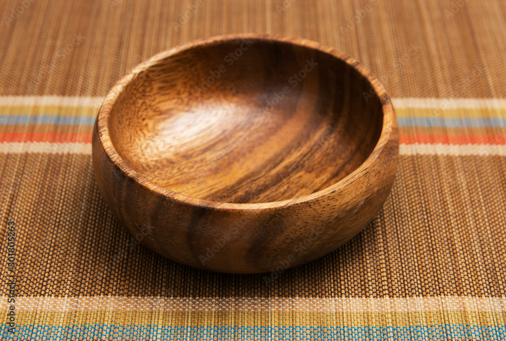 Natural bamboo Mat and wooden bowl. Eastern theme