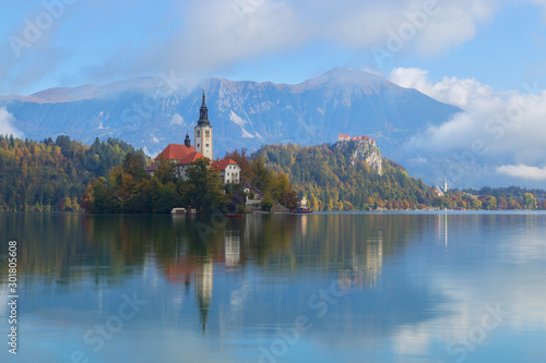 Fototapeta Naklejka Na Ścianę i Meble -  View of beautiful lake Bled with the island and the church on a stunning morning