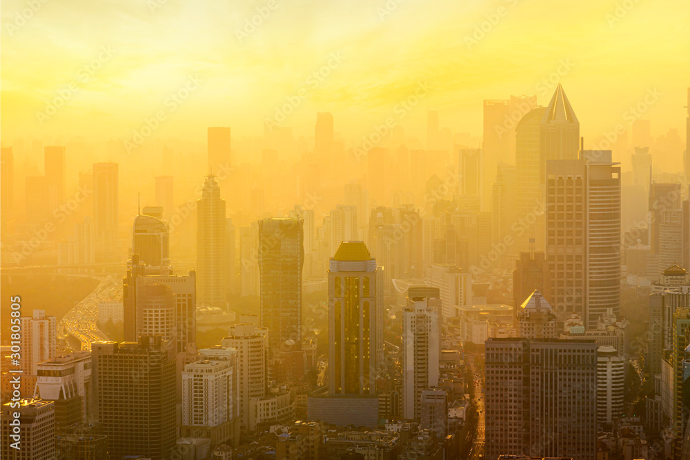 Shanghai cityscape sunset twilight with smog lies over the skyline of Historical architecture and modern skyscraper on the bund of Shanghai, China Shanghai cityscape sunset twilight with smog lies over the skyline of Historical architecture and modern skyscraper on the bund of Shanghai, China