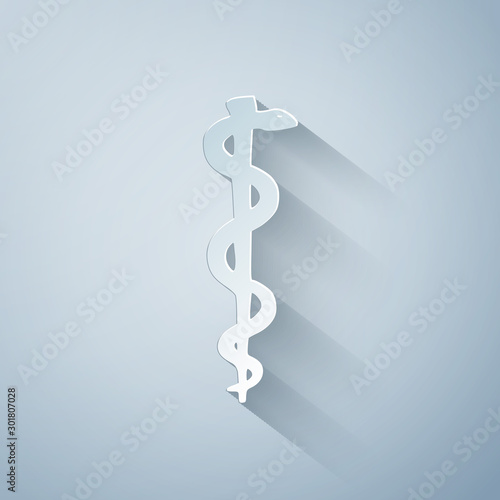 Paper cut Rod of asclepius snake coiled up silhouette icon isolated on grey background. Emblem for drugstore or medicine, pharmacy snake symbol. Paper art style. Vector Illustration