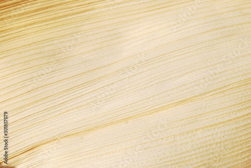 Cream colored stripes surface is caused by corn husk.