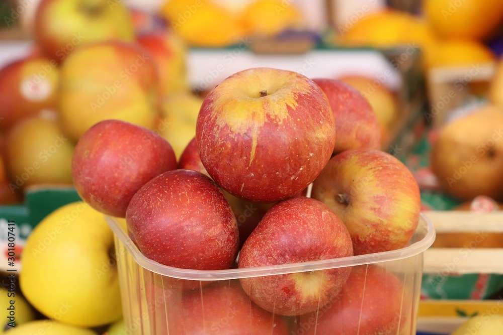 apples on display on a counter in a market