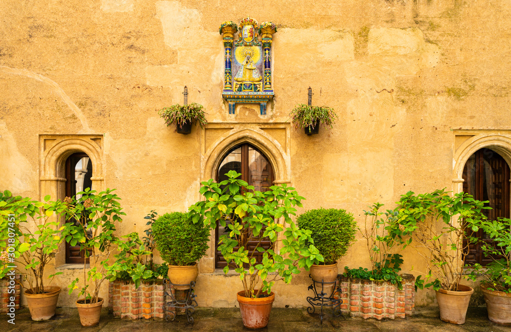 Courtyard in the monastery of Guadalupe in Cáceres in Spain with an image of the Virgin Mary.