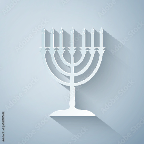 Paper cut Hanukkah menorah icon isolated on grey background. Religion icon. Hanukkah traditional symbol. Holiday religion, jewish festival of Lights. Paper art style. Vector Illustration