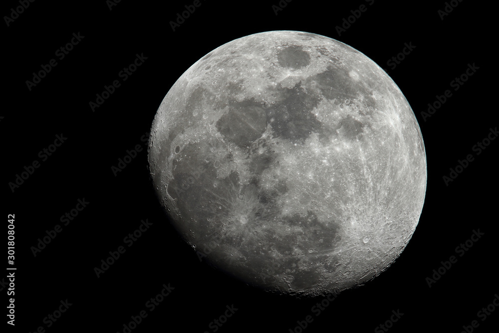 Gibbous moon in crescent room with detail of its craters and seas Gibbous moon in crescent room with detail of its craters and seas