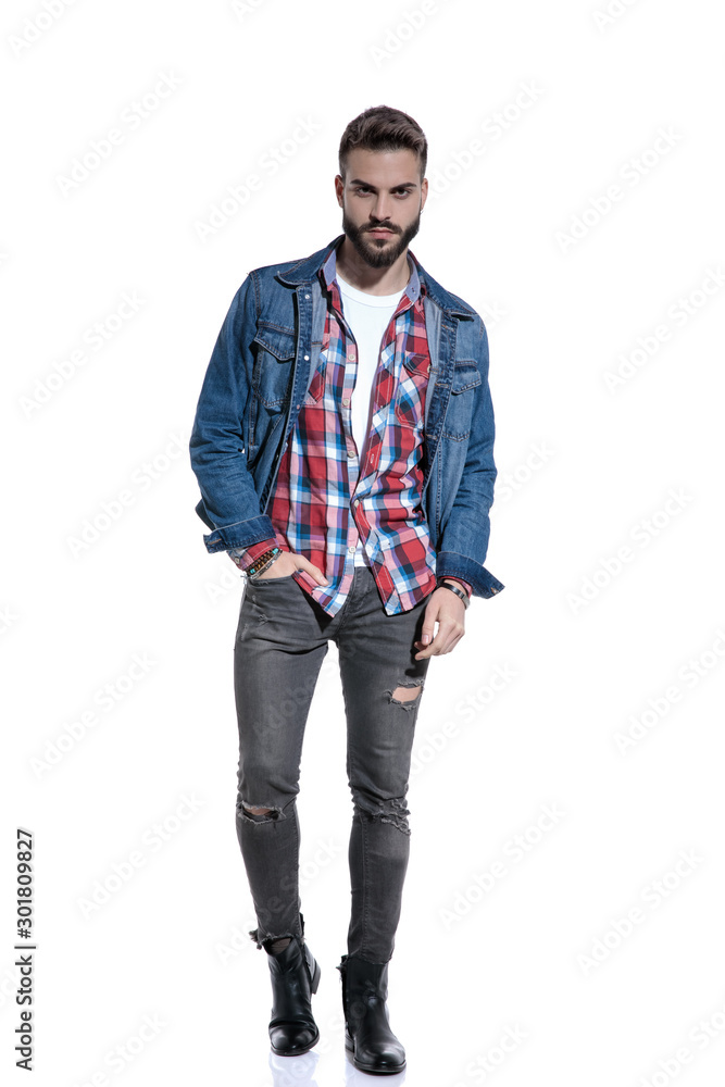 Fototapeta premium sexy fashion model in plaid shirt holding hand in pocket