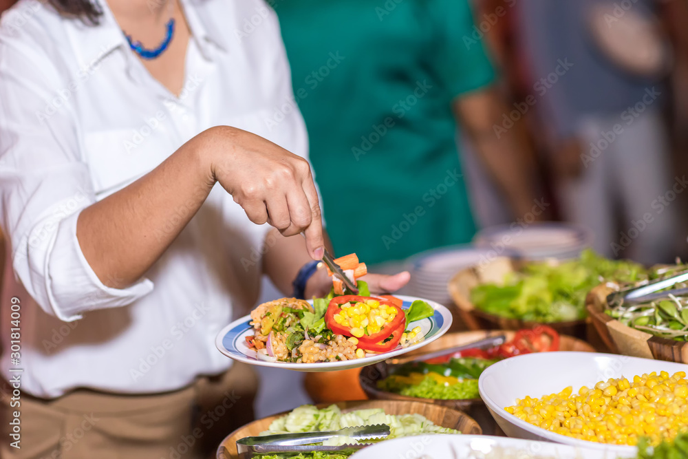 Food Buffet Catering Dining Eating Party Sharing Concept.people group catering buffet food indoor in luxury restaurant with meat colorful fruits and vegetables Food Buffet Catering Dining Eating Party Sharing Concept.people group catering buffet food indoor in luxury restaurant with meat colorful fruits and vegetables