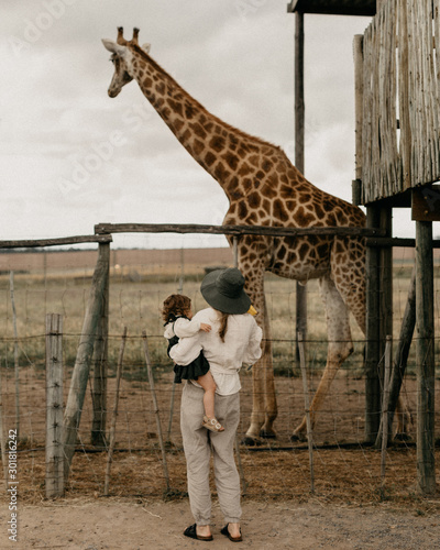 Mother, child and giraffe