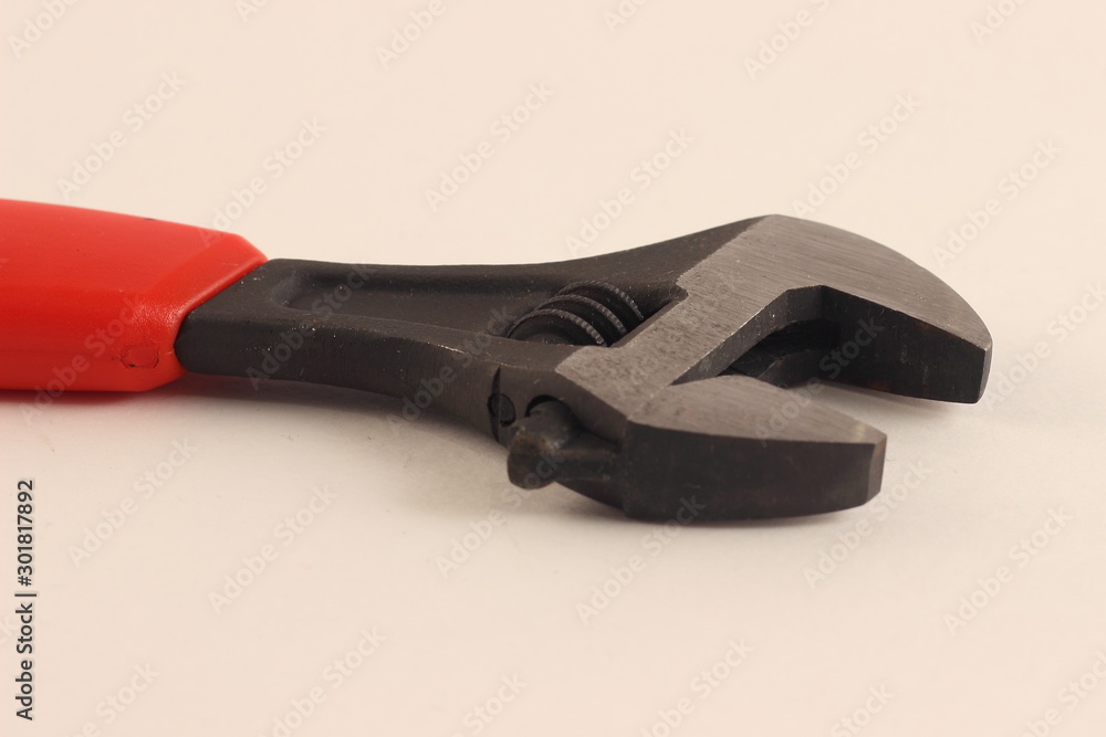 Obraz premium Close up open adjustable wrench, monkey spanner tool on white background