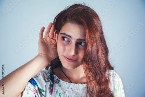 young girl hand ear