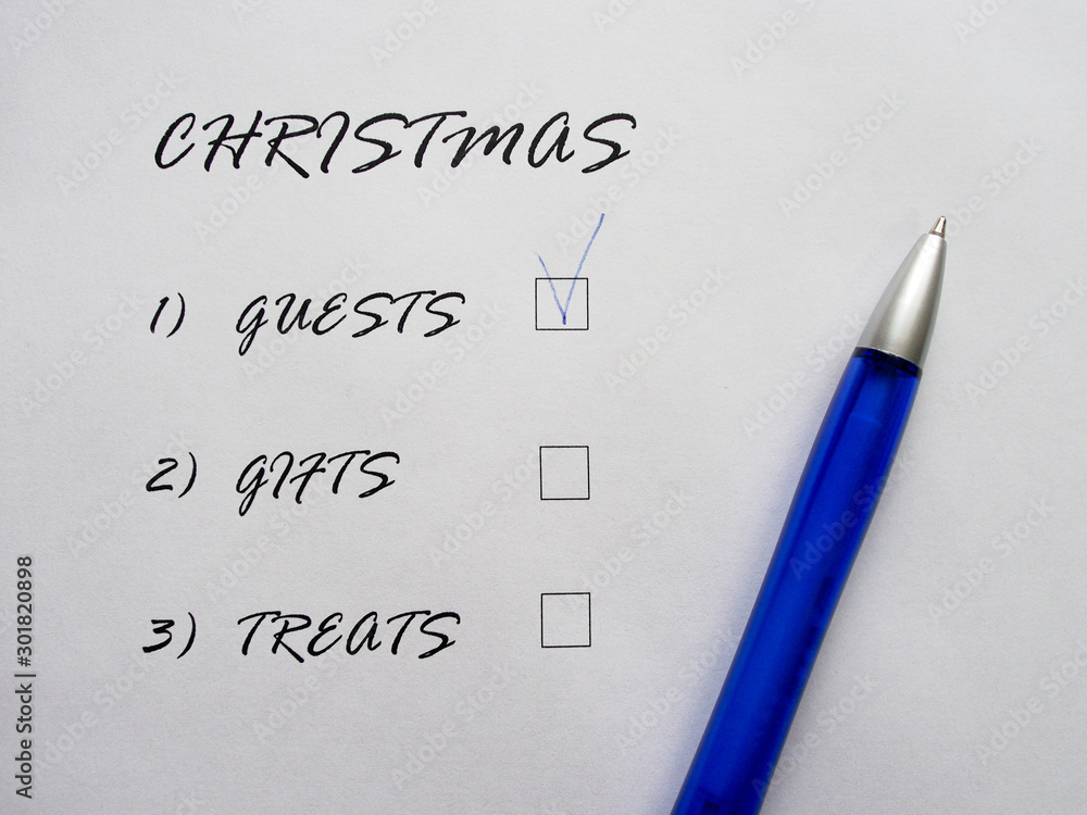 Checklist of Christmas holidays, text on a white sheet of paper next to a blue pen. List of pre-holiday worries. Checklist of Christmas holidays, text on a white sheet of paper next to a blue pen. List of pre-holiday worries.