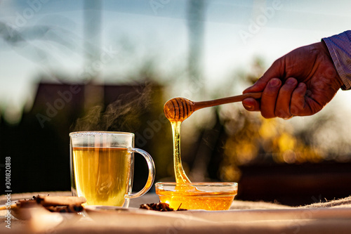 hot tea and honey in teacup outdoor