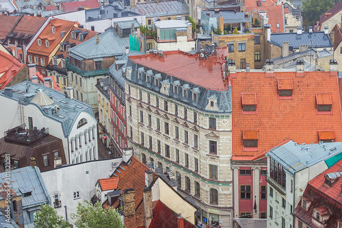 Aerial view of beautiful buildings of Riga Old Town from Saint Peter's church on cloudy, foggy and rainy day, Riga, Latvia. Soft selective focus