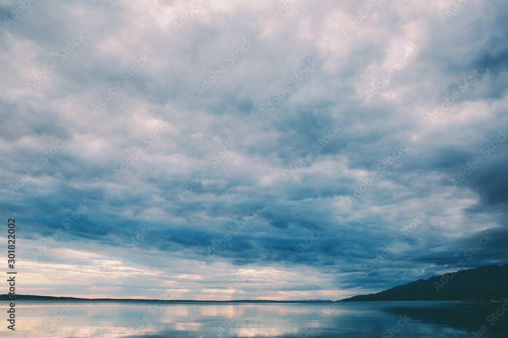 Sea and sky with clouds at sunset.