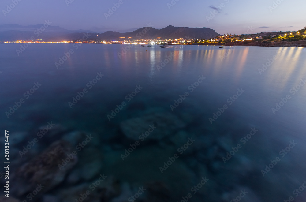 Fototapeta premium Panoramic view on the beach in Crete in the evening. Long exposure.