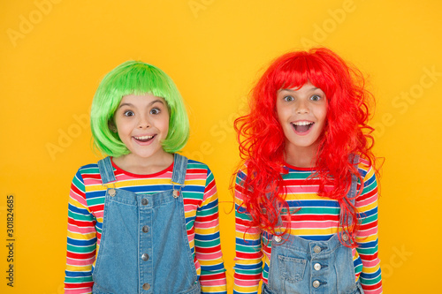 What a big surprise. Surprised girls. Small children keep mouths open in surprise yellow background. Little kids look with surprise. Surprise and shock. Party. Cosplay. Beauty and fashion