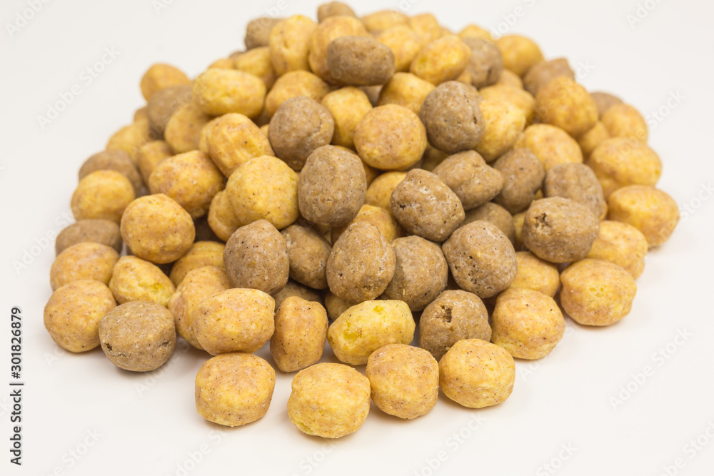 heap of sweet puffed corn balls with peanut butter heap of sweet puffed corn balls with peanut butter