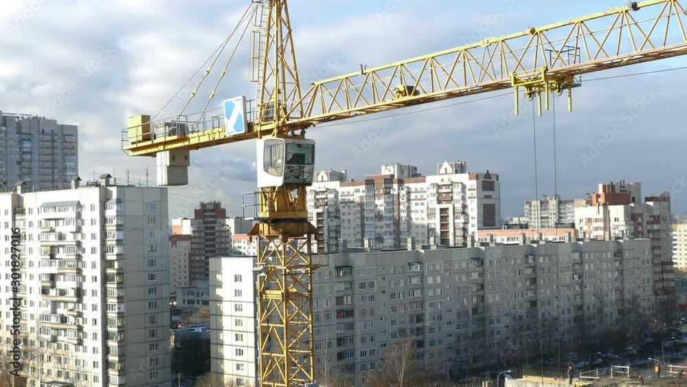 St. Petersburg, Russia, October 12 , 2019. tower crane over a construction site time lapse, zoom out