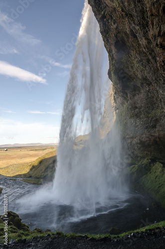 amazing Seljalandfoss waterfall in sunny autumn day, Iceland. Famous tourist attraction