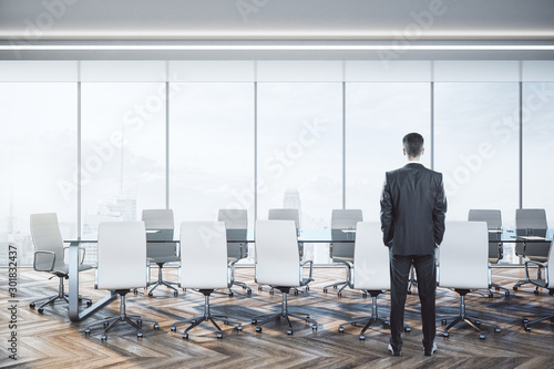 Businessman standing in luxury conference room