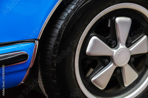 detail of wheel of a blue car