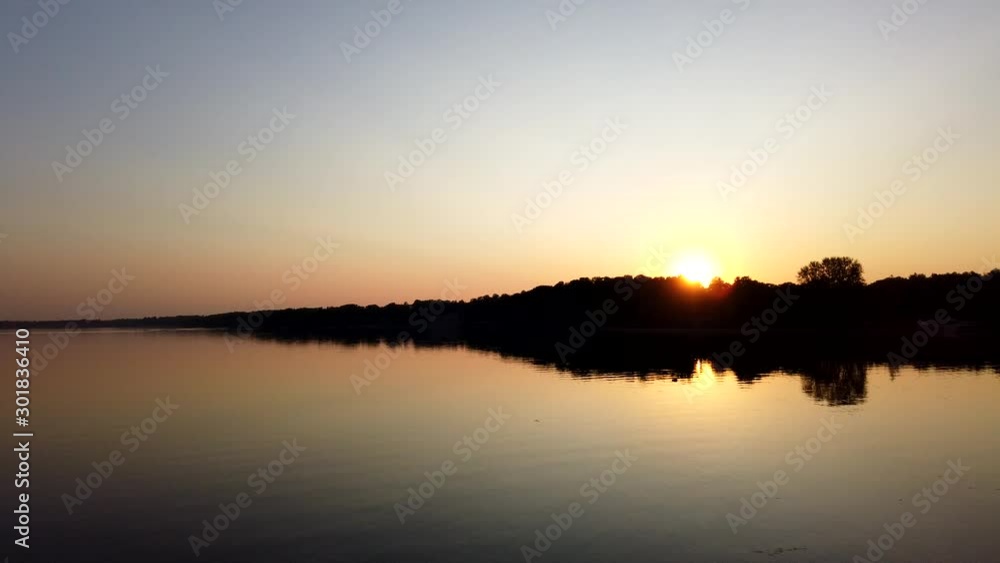 Timelapse. Sunset on the quiet river in the summer. Evening. Timelapse. Sunset on the quiet river in the summer. Evening.
