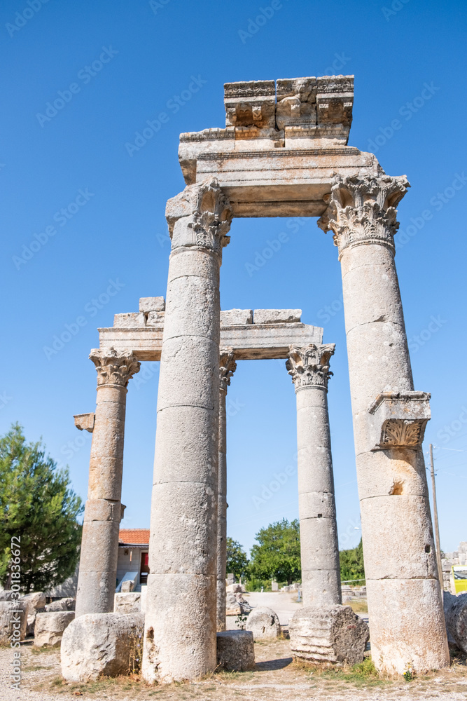 With blue sky,Marble columns of Temple of Tyche, goddess of fortune, Roman, late first century AD, Olba, (Uzuncaburc), Silifke, Mersin,Turkey