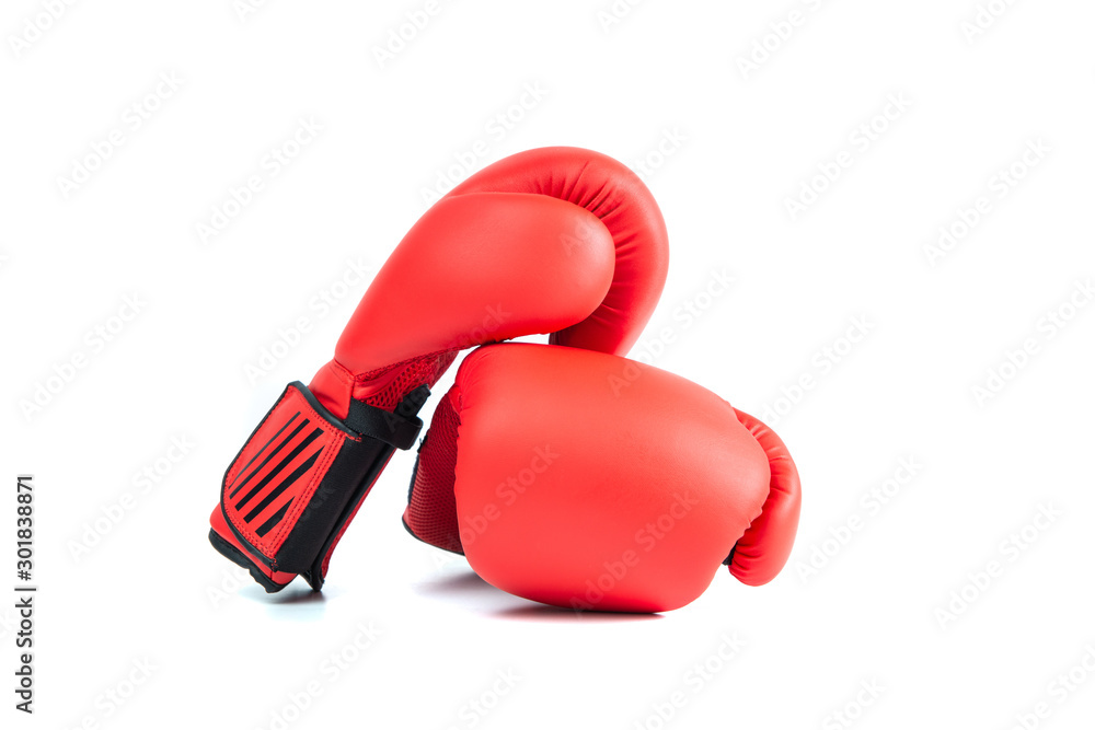 Red boxing gloves isolated on white. The concept of sport and active leisure. On the table are red boxing gloves, kickboxing. Playing sports, taking care of your figure, fight and self-defense.
