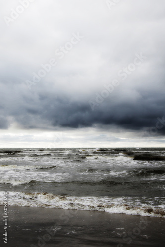 dramatic stormy clouds on the beach © Iveta