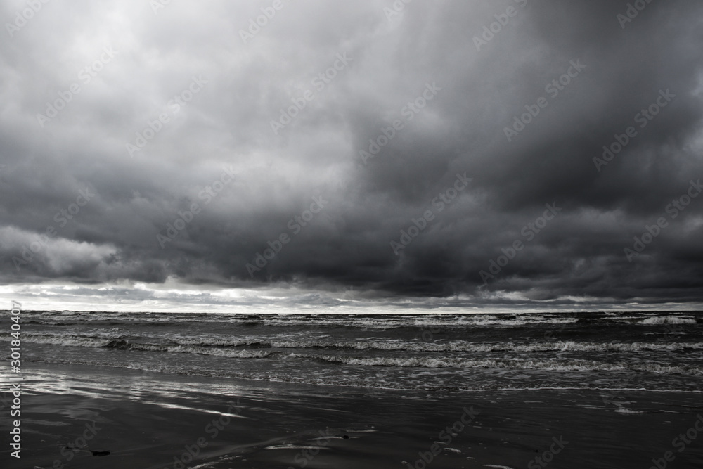 dramatic stormy clouds on the beach