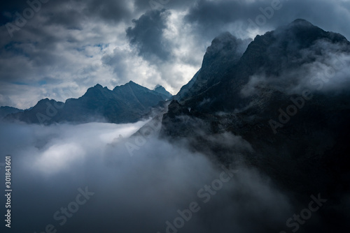 Rysy peak in the high Tatra mountain in foggy day