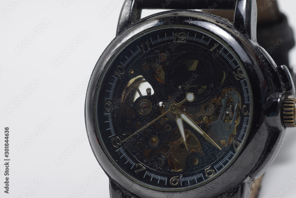 Mechanical skeleton watch on a white background