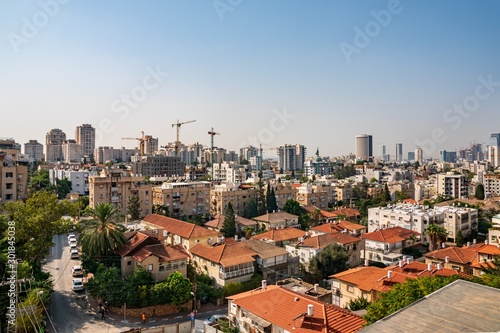 Givatayim, Tel Aviv Israel. Givatayim and Tel Aviv skyline in early morning. View to the city from Givataim hills. Old houses and new modern skyscrapers.