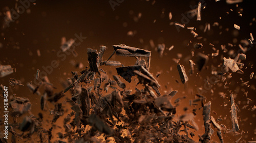 Fotografie, Obraz Flying pieces of crushed chocolate pieces