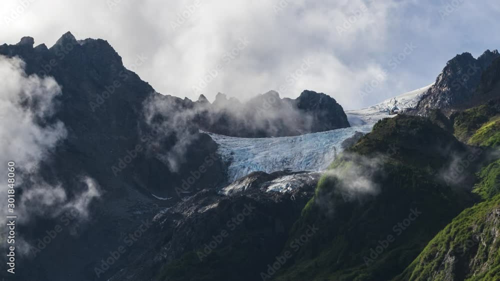 Clouds moving through peaks of glaciated mountains in British Columbia, Canada 4K timelapse Clouds moving through peaks of glaciated mountains in British Columbia, Canada 4K timelapse