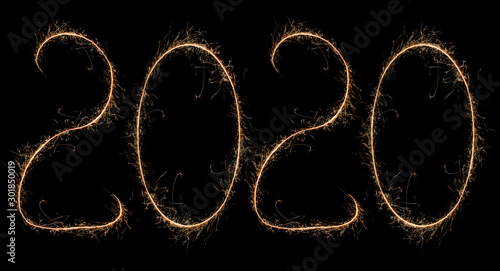 Happy New Year. 2020 written by bright sparkling sparklers. New year logo for design.