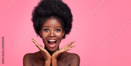 African Woman and Smiles Widely. Beauty Concept.