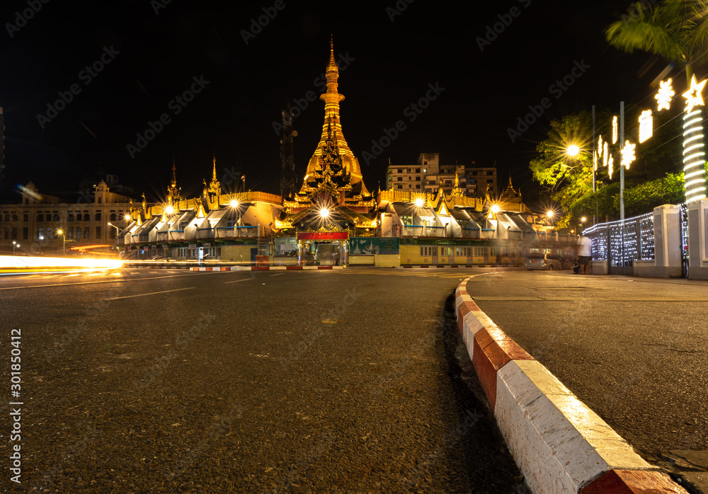 Night cityscape with golden octagon Sula Pagoda, Yangon Myanmar
