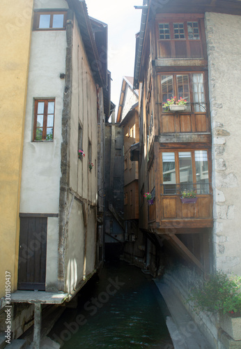 Narrow French bun. Old houses with balconies over the canals. The city on the water of Annecy.