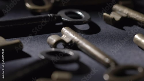 Wallpaper Mural Old keys rotating over black background Torontodigital.ca