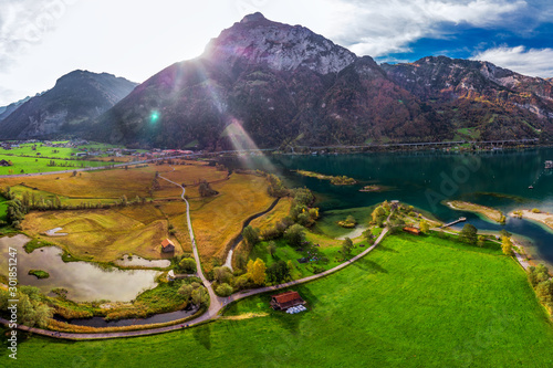 Areal view of Fluelen town and lake Lucerne in canton Uri, Switzerland, Europe photo