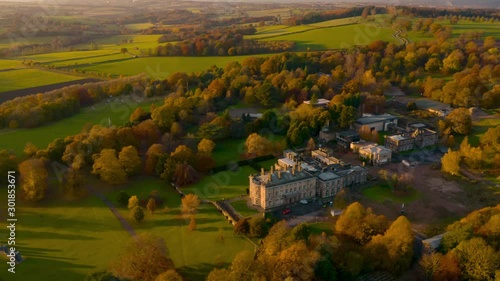 Aerial footage of Autumn Fall colours at Sunset around a Bretton Hall, a beautiful Georgian Country House near Wakefield, UK