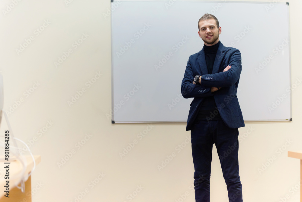 Confidence and business concept. Portrait of charming successful young businessman. Confidence and business concept. Portrait of charming successful young businessman.
