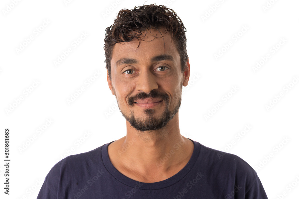 mixed race man looking happily in camera. Standing against white background. - obrazy, fototapety, plakaty 