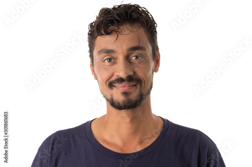 mixed race man looking happily in camera. Standing against white background.