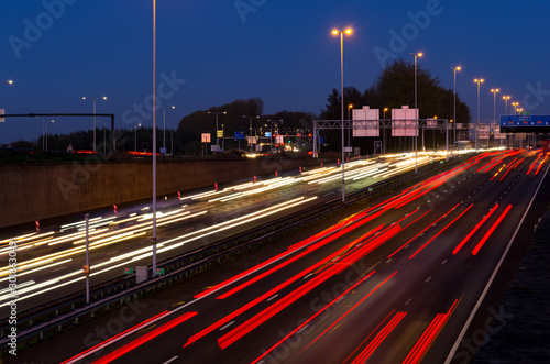 Evening rush hour on the motorway at the Gouwe aquaduct (A20/A12) in the Netherlands. Long shutter/exposure speed image.