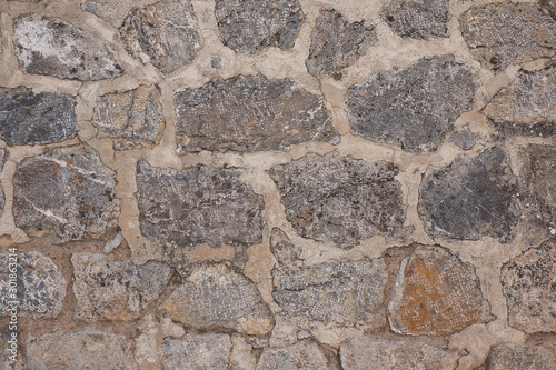 Texture of a stone wall. Old castle stone wall texture background. Stone wall as a background or texture. Part of a stone wall, for background or texture