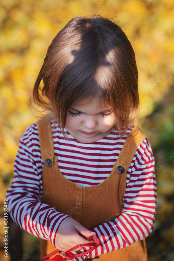 Cute little baby girl is playing and smiling outdoors. Cute little baby girl is playing and smiling outdoors.
